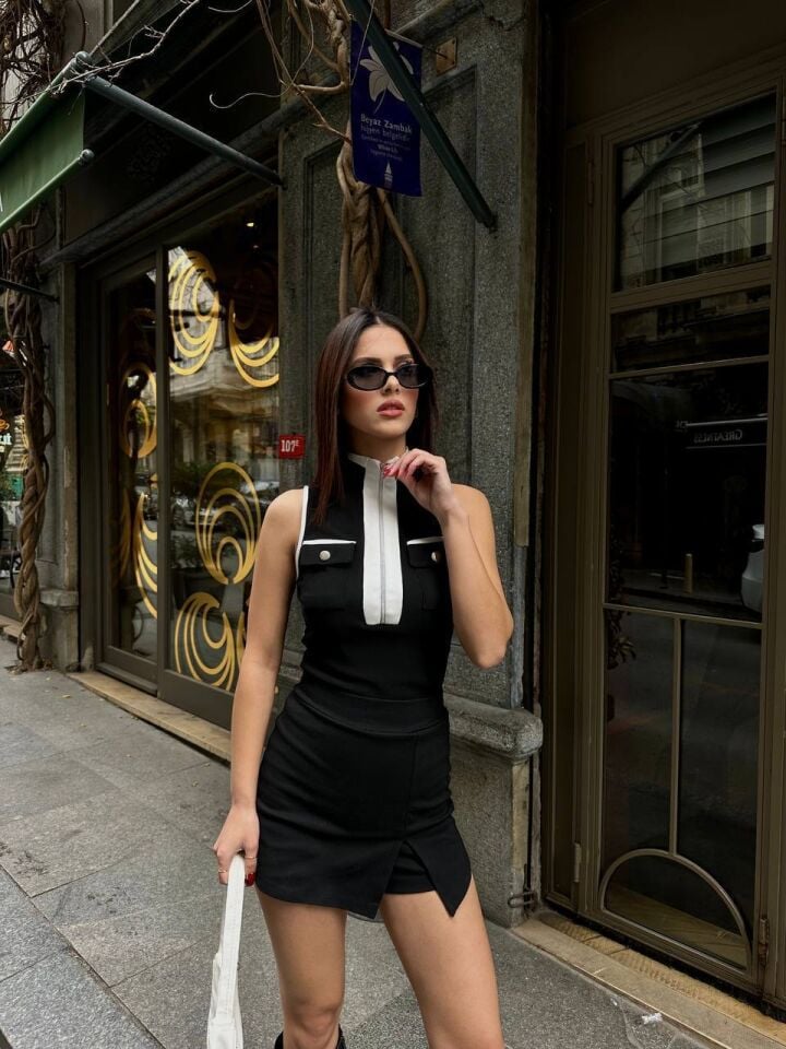 FERMUARLI CEPLİ KOLSUZ BLUZ